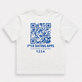 A white short-sleeve t-shirt with a blue graphic print on the front, featuring a QR code, the text 'F*CK DATING APPS', 'LET'S DO REAL LIFE INSTEAD', and a unique code