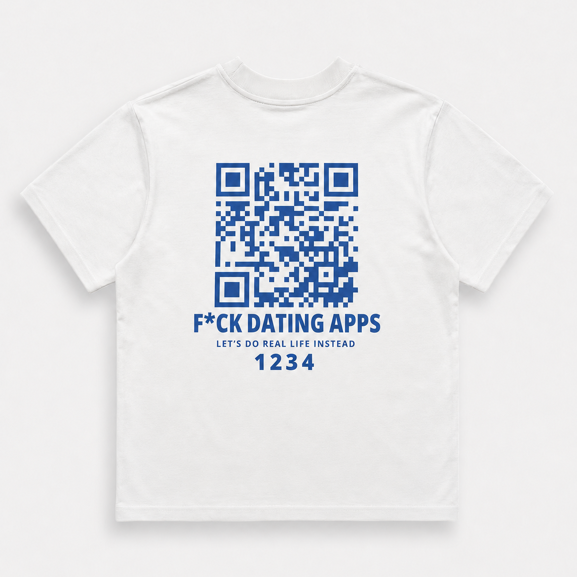 A white short-sleeve t-shirt with a blue graphic print on the front, featuring a QR code, the text 'F*CK DATING APPS', 'LET'S DO REAL LIFE INSTEAD', and a unique code